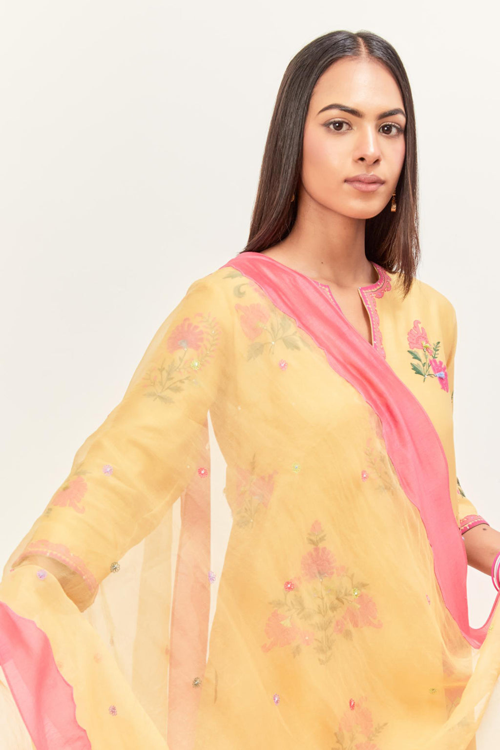 Yellow & pink silk organza narrow dupatta, highlighted with all-over delicate thread flower and applique floral boota at all four corners.