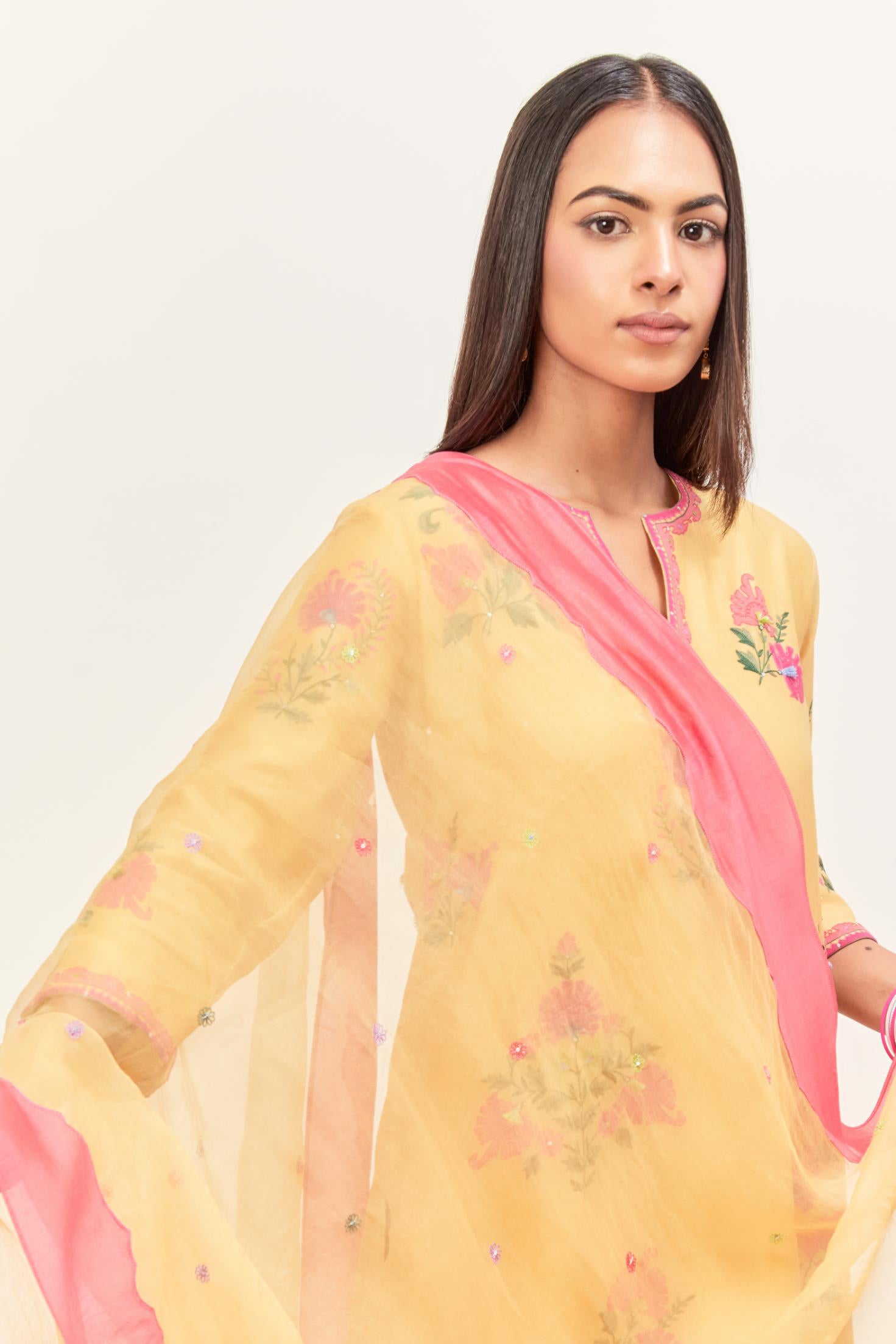 Yellow silk chanderi straight kurta set with all-randomly placed appliqued assorted bootas, highlighted with aari threadwork & sequins.