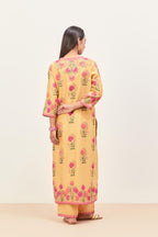 Yellow silk chanderi straight kurta set, decorated with appliqued jaal neckline and hem. The field has symmetrically placed bootas.