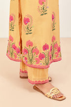 Yellow silk chanderi straight kurta set, decorated with appliqued jaal neckline and hem. The field has symmetrically placed bootas.