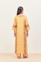 Yellow silk chanderi straight kurta set, decorated with appliqué borders along the side panels, neck and sleeves.