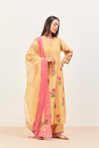 Yellow silk chanderi kurta set with pin tucks at yoke and all-over applique, highlighted with aari threadwork & sequins.