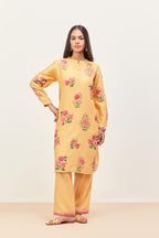 Yellow silk chanderi straight short easy fit kurta set with all-over assorted flower applique, highlighted with aari threadwork & sequins.