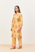 Yellow silk chanderi straight short easy fit kurta set with all-over assorted flower applique, highlighted with aari threadwork & sequins.