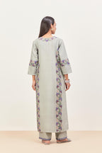 Bluish Grey silk chanderi straight kurta set, decorated with appliqué borders along the side panels, neck and sleeves.