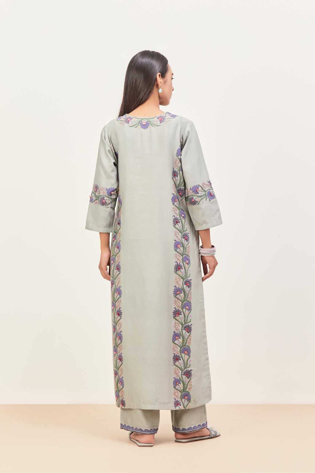 Bluish Grey silk chanderi straight kurta set, decorated with appliqué borders along the side panels, neck and sleeves.