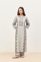 Bluish Grey silk chanderi straight kurta set, decorated with appliqué borders along the side panels, neck and sleeves.