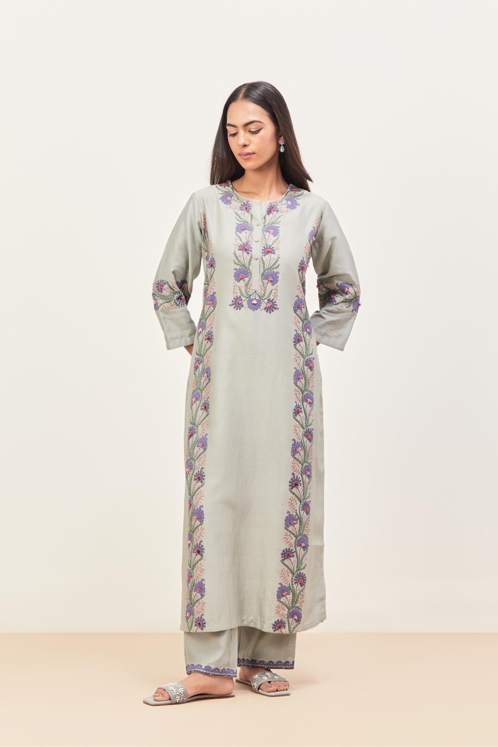 Bluish Grey silk chanderi straight kurta set, decorated with appliqué borders along the side panels, neck and sleeves.