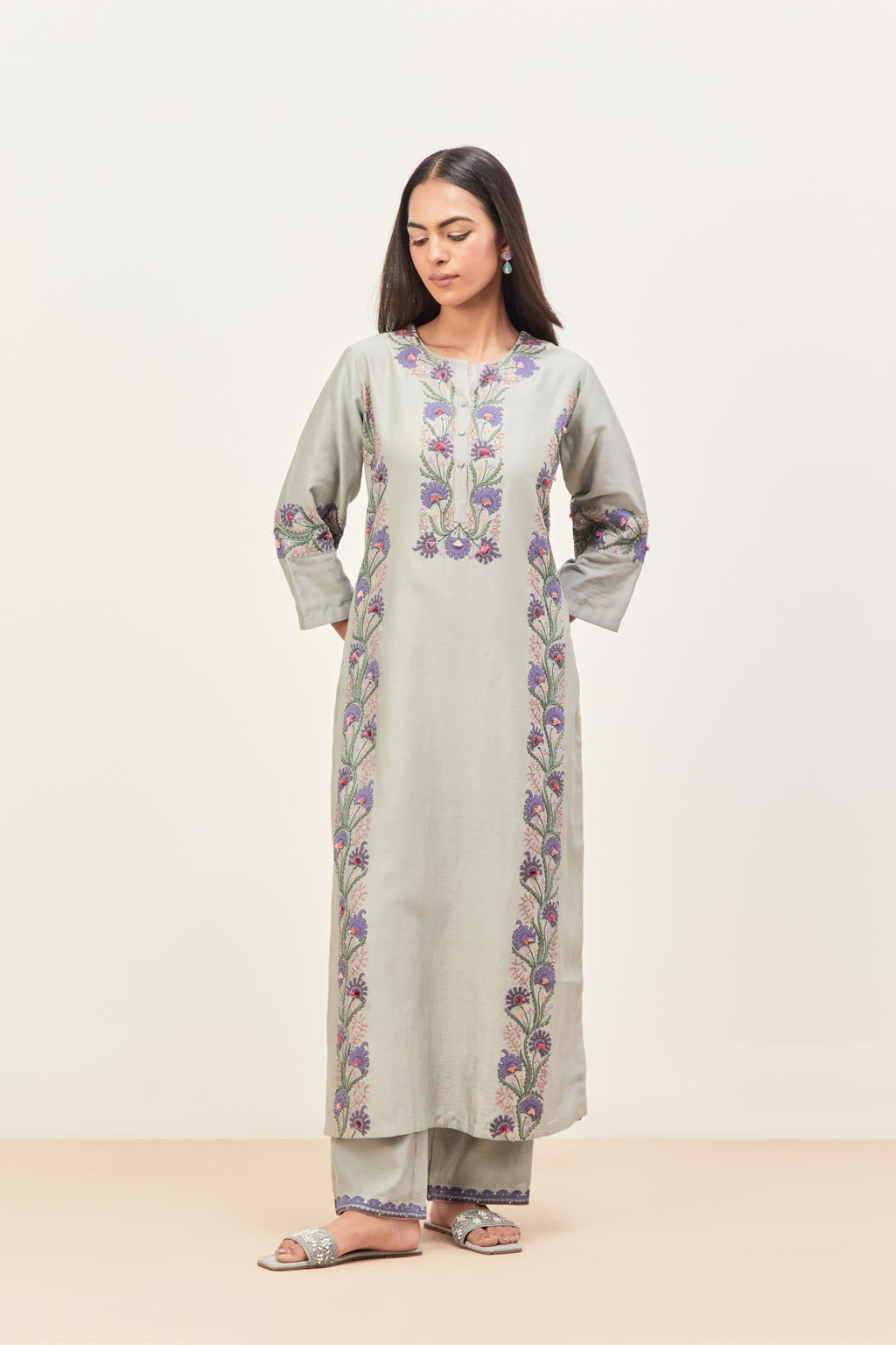 Bluish Grey silk chanderi straight kurta set, decorated with appliqué borders along the side panels, neck and sleeves.