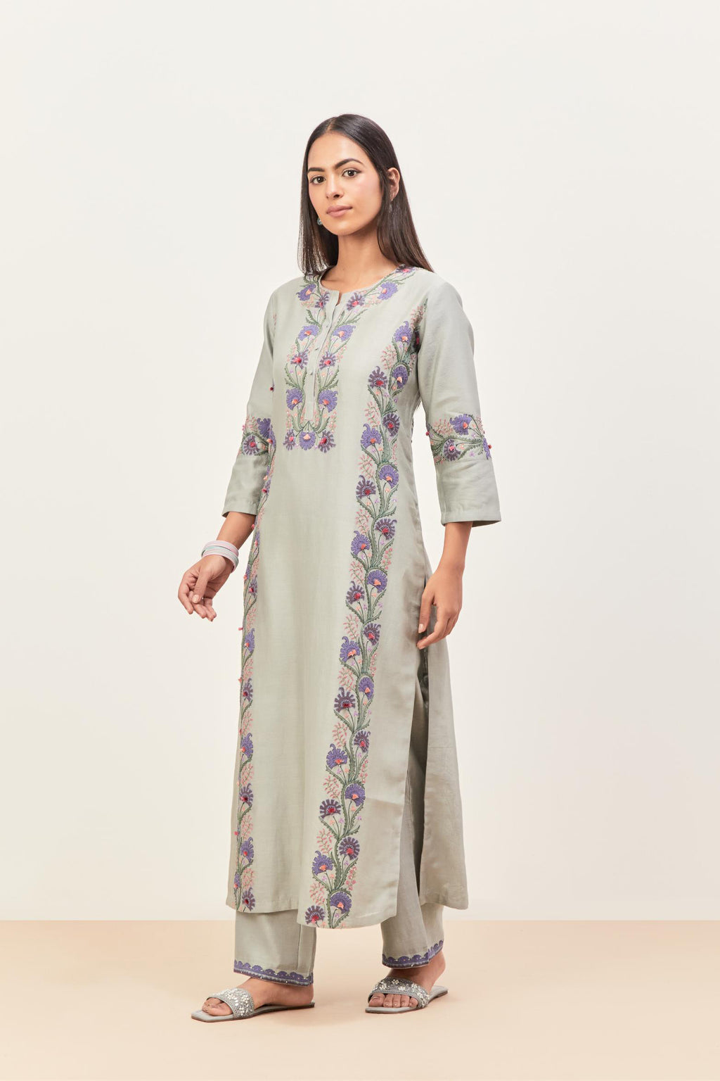 Bluish Grey silk chanderi straight kurta set, decorated with appliqué borders along the side panels, neck and sleeves.