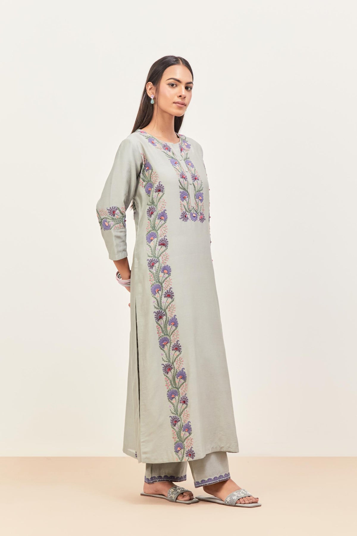 Bluish Grey silk chanderi straight kurta set, decorated with appliqué borders along the side panels, neck and sleeves.