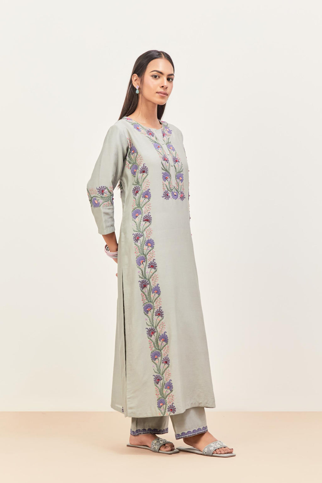 Bluish Grey silk chanderi straight kurta set, decorated with appliqué borders along the side panels, neck and sleeves.