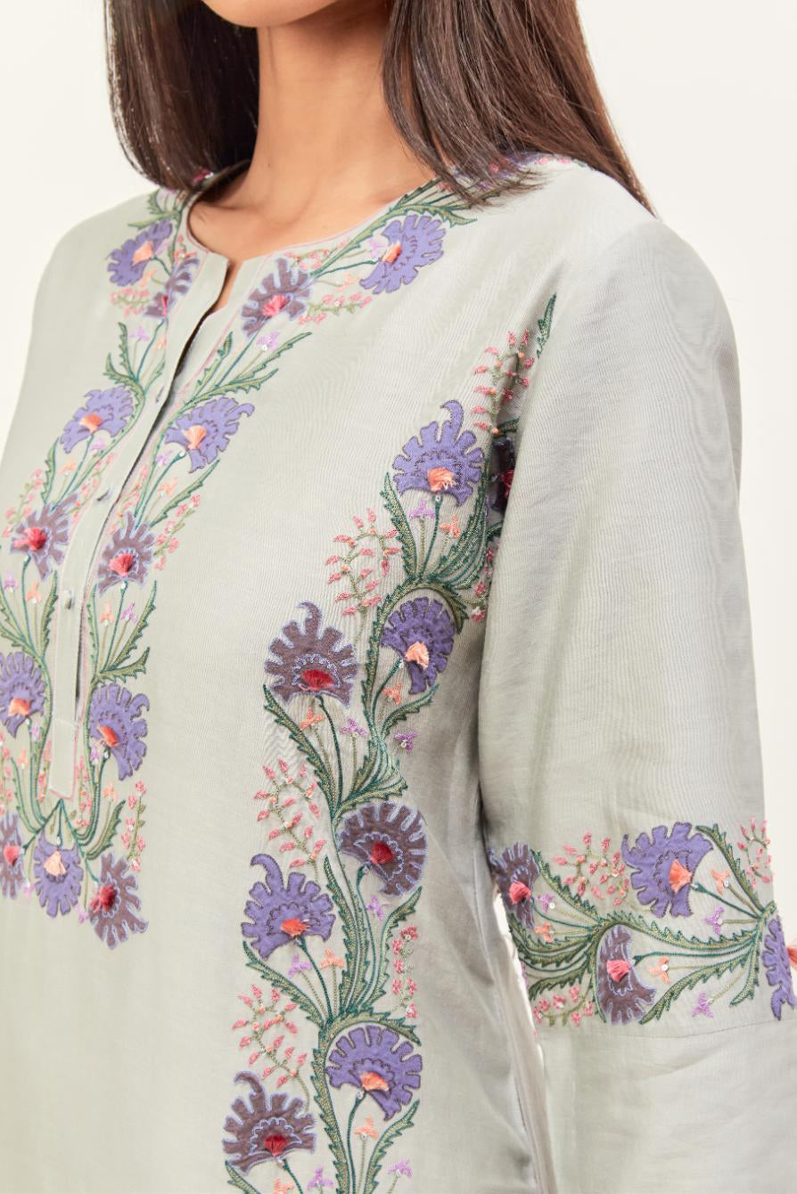 Bluish Grey silk chanderi straight kurta set, decorated with appliqué borders along the side panels, neck and sleeves.