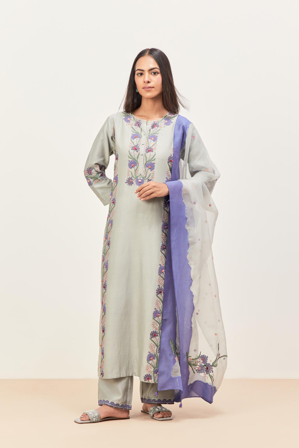 Bluish Grey silk chanderi straight kurta set, decorated with appliqué borders along the side panels, neck and sleeves.