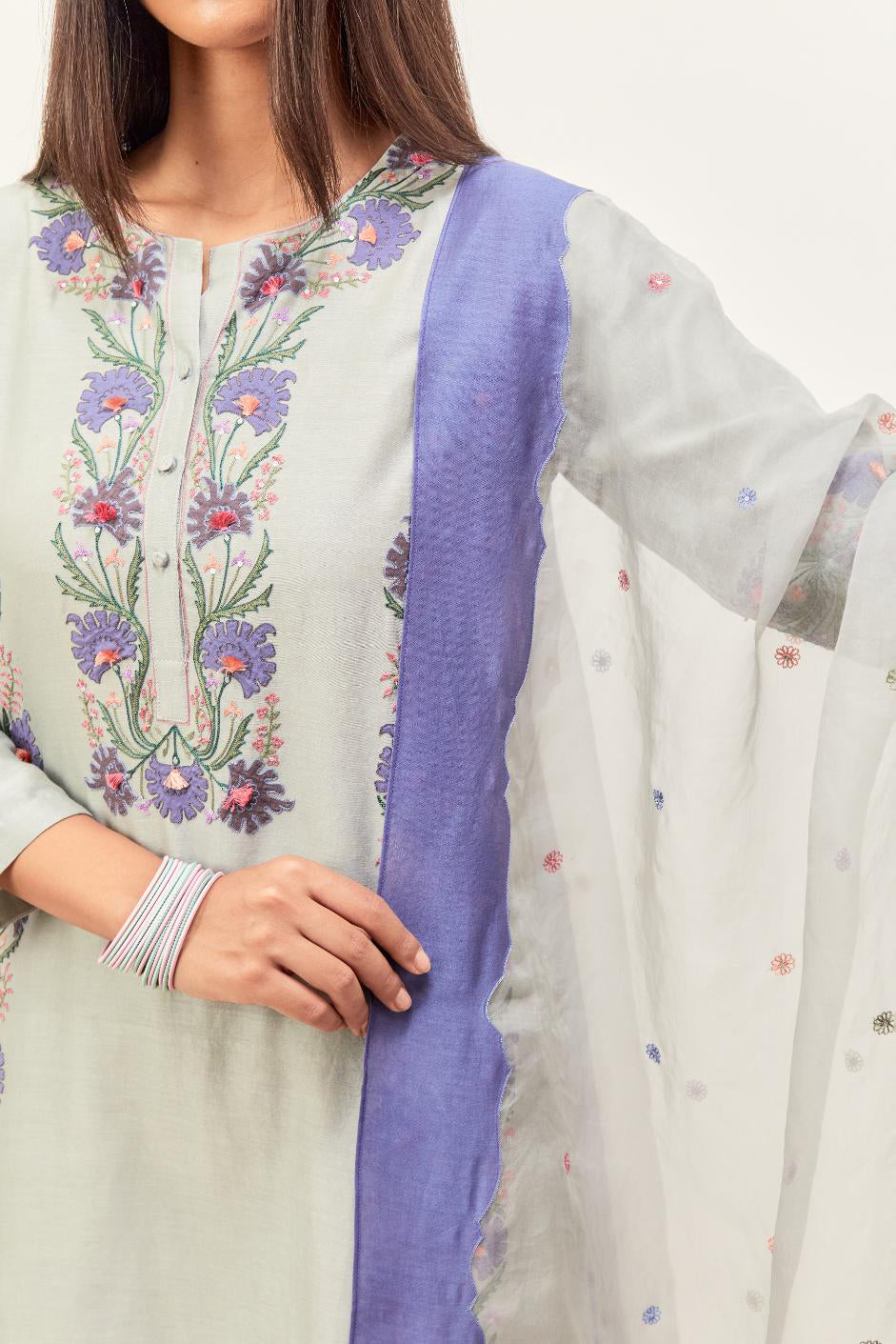 Bluish Grey silk chanderi straight kurta set, decorated with appliqué borders along the side panels, neck and sleeves.