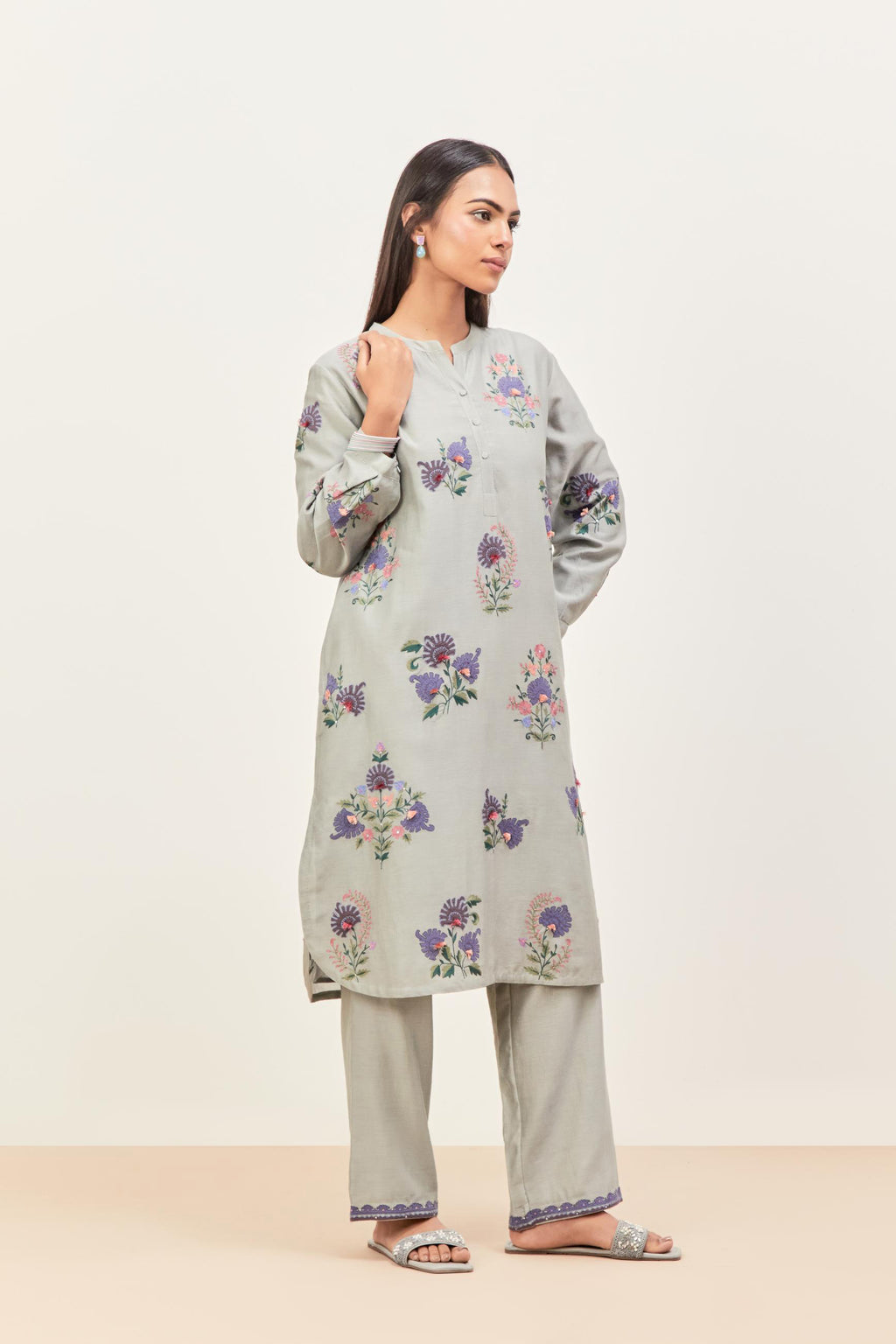 Bluish Grey silk chanderi straight short easy fit kurta set with all-over assorted flower applique, highlighted with aari threadwork & sequins.