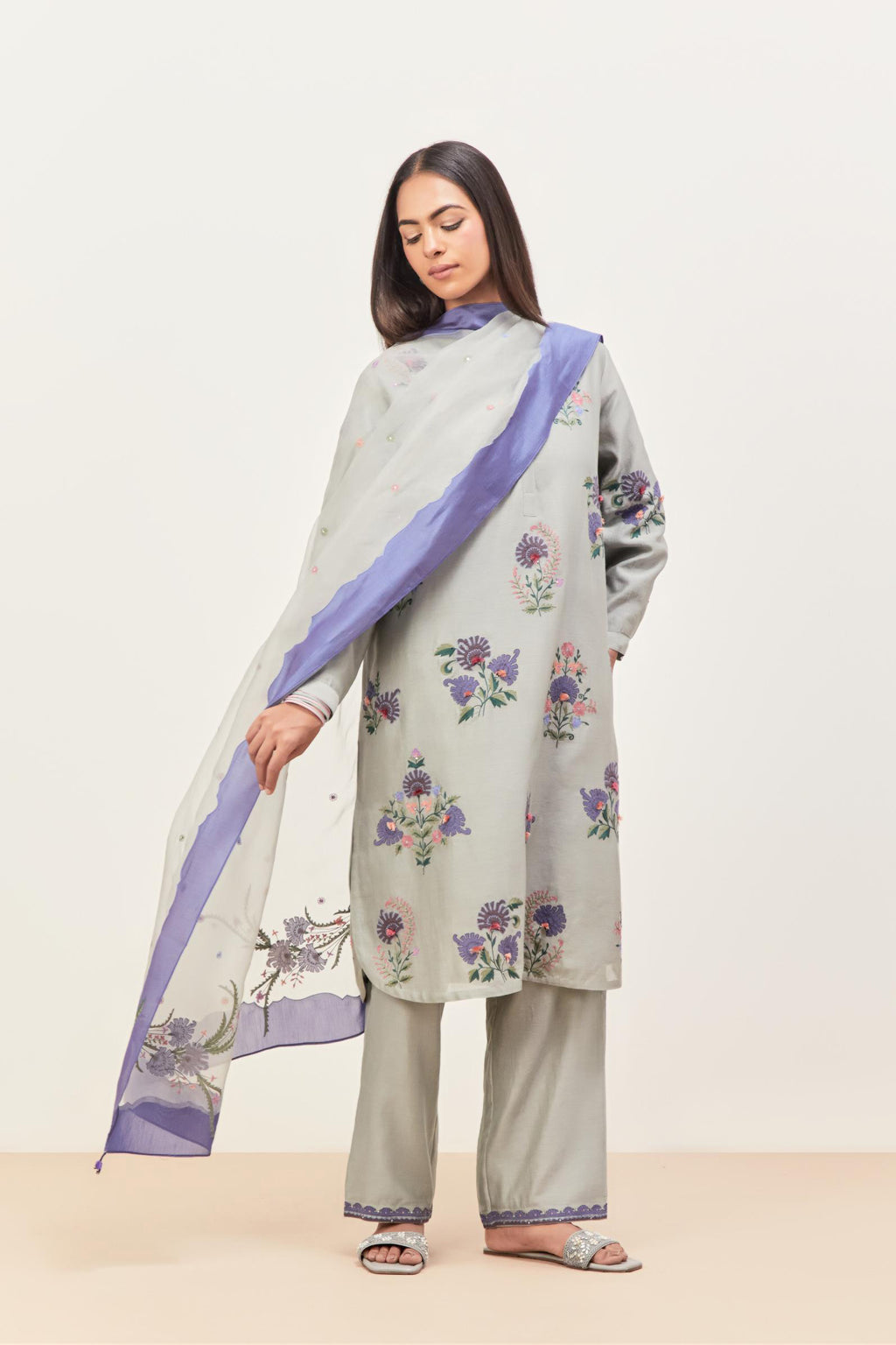 Bluish Grey silk chanderi straight short easy fit kurta set with all-over assorted flower applique, highlighted with aari threadwork & sequins.