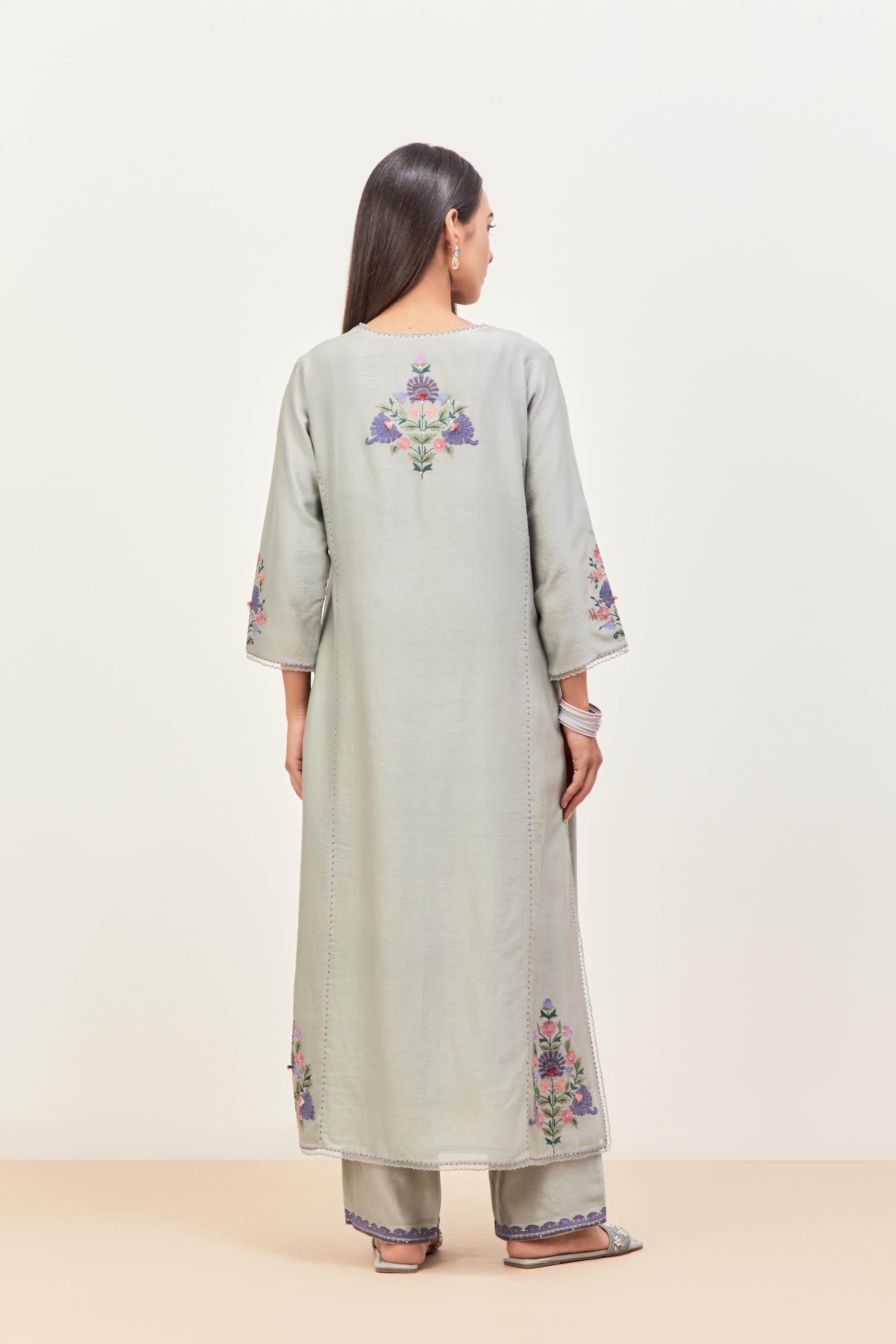 Bluish Grey silk chanderi kurta set with pin tucks in the front & back and floral applique boota at sides, highlighted with aari threadwork & sequins.