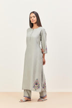 Bluish Grey silk chanderi kurta set with pin tucks in the front & back and floral applique boota at sides, highlighted with aari threadwork & sequins.