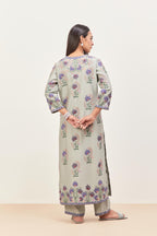 Bluish Grey silk chanderi straight kurta set, decorated with appliqued jaal neckline and hem. The field has symmetrically placed bootas.