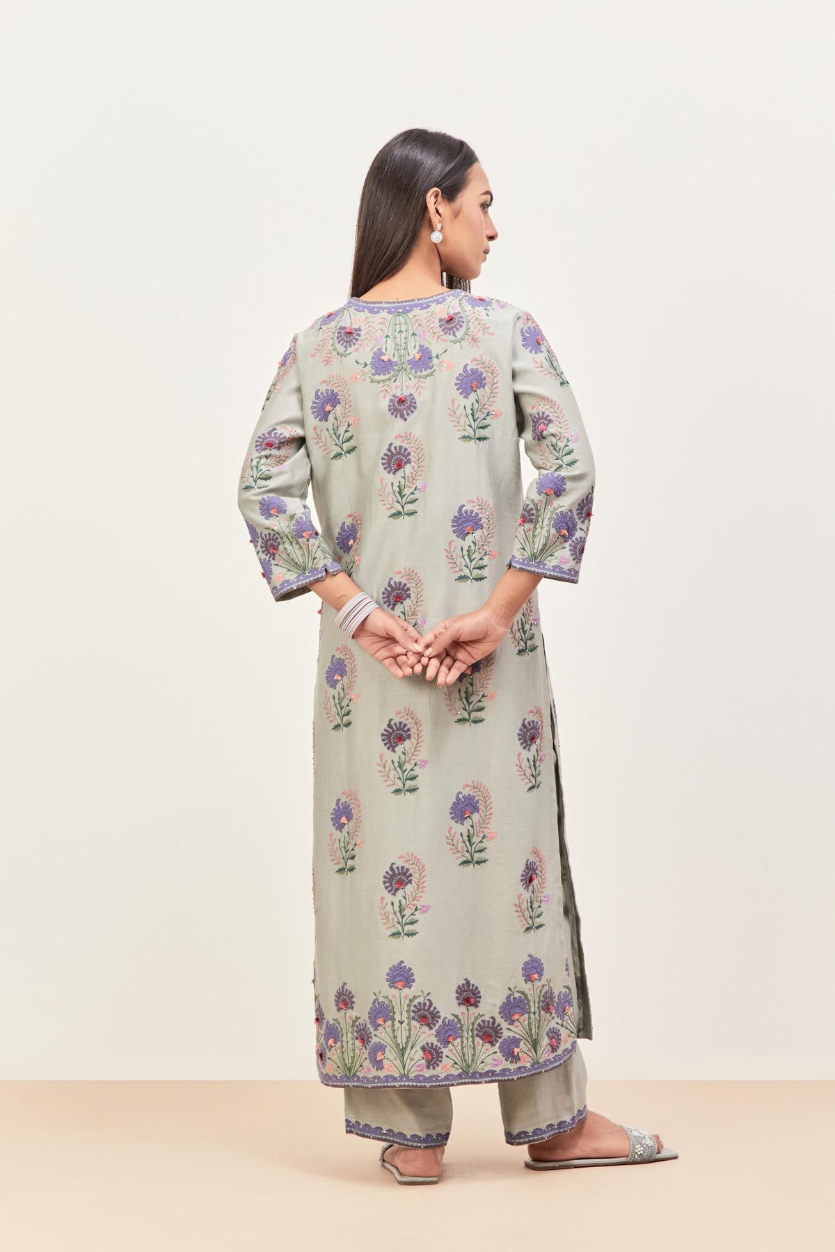 Bluish Grey silk chanderi straight kurta set, decorated with appliqued jaal neckline and hem. The field has symmetrically placed bootas.
