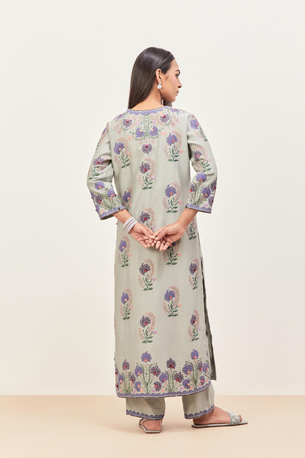 Bluish Grey silk chanderi straight kurta set, decorated with appliqued jaal neckline and hem. The field has symmetrically placed bootas.