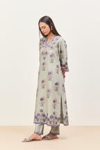 Bluish Grey silk chanderi straight kurta set, decorated with appliqued jaal neckline and hem. The field has symmetrically placed bootas.