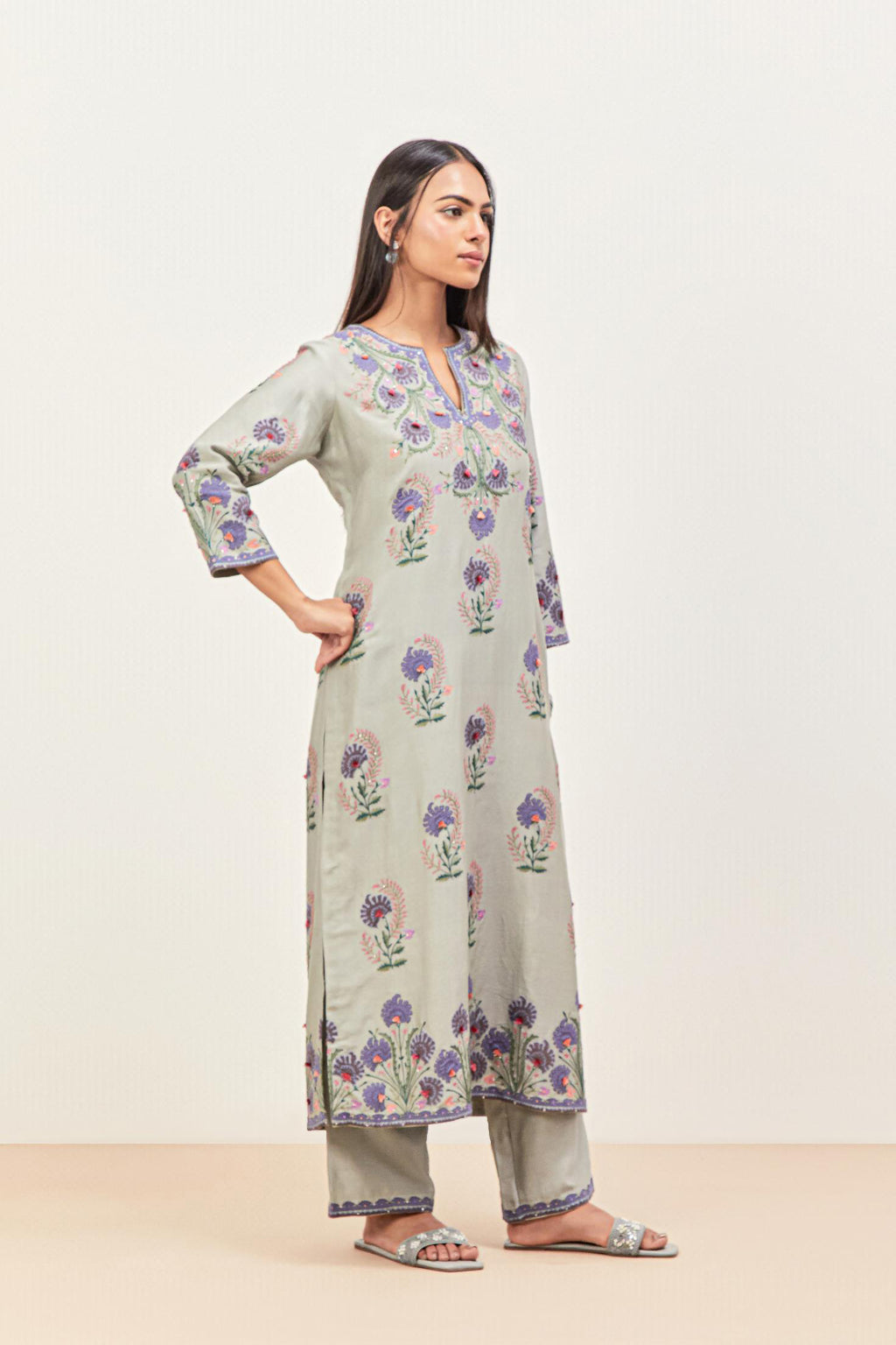 Bluish Grey silk chanderi straight kurta set, decorated with appliqued jaal neckline and hem. The field has symmetrically placed bootas.