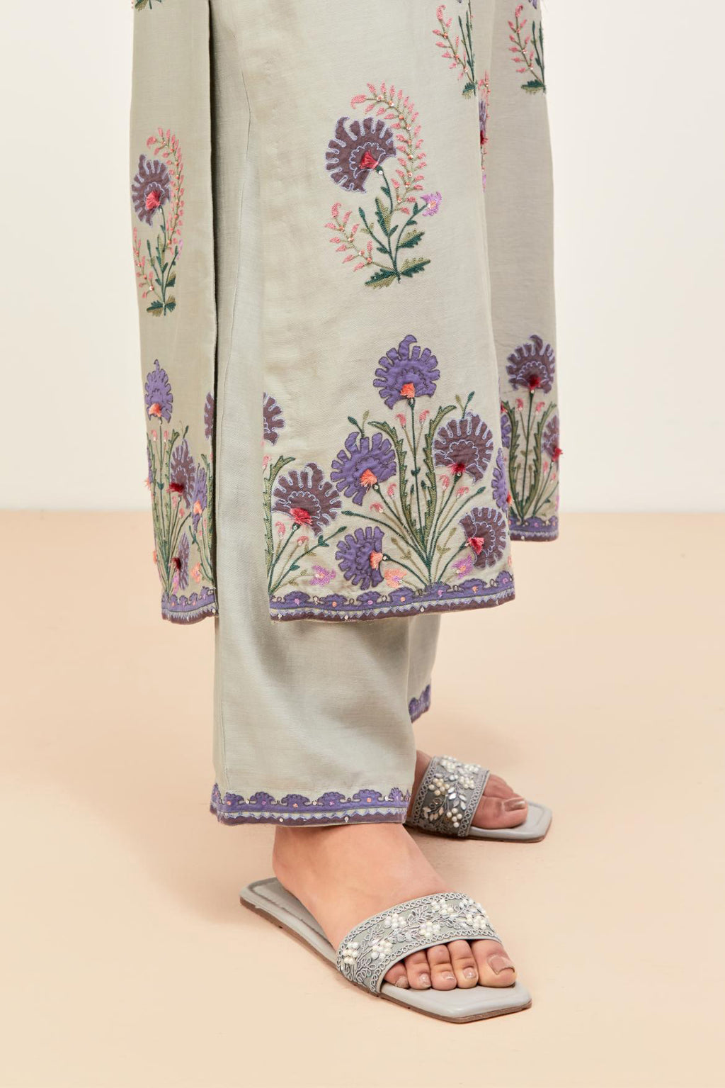 Bluish Grey silk chanderi straight kurta set, decorated with appliqued jaal neckline and hem. The field has symmetrically placed bootas.