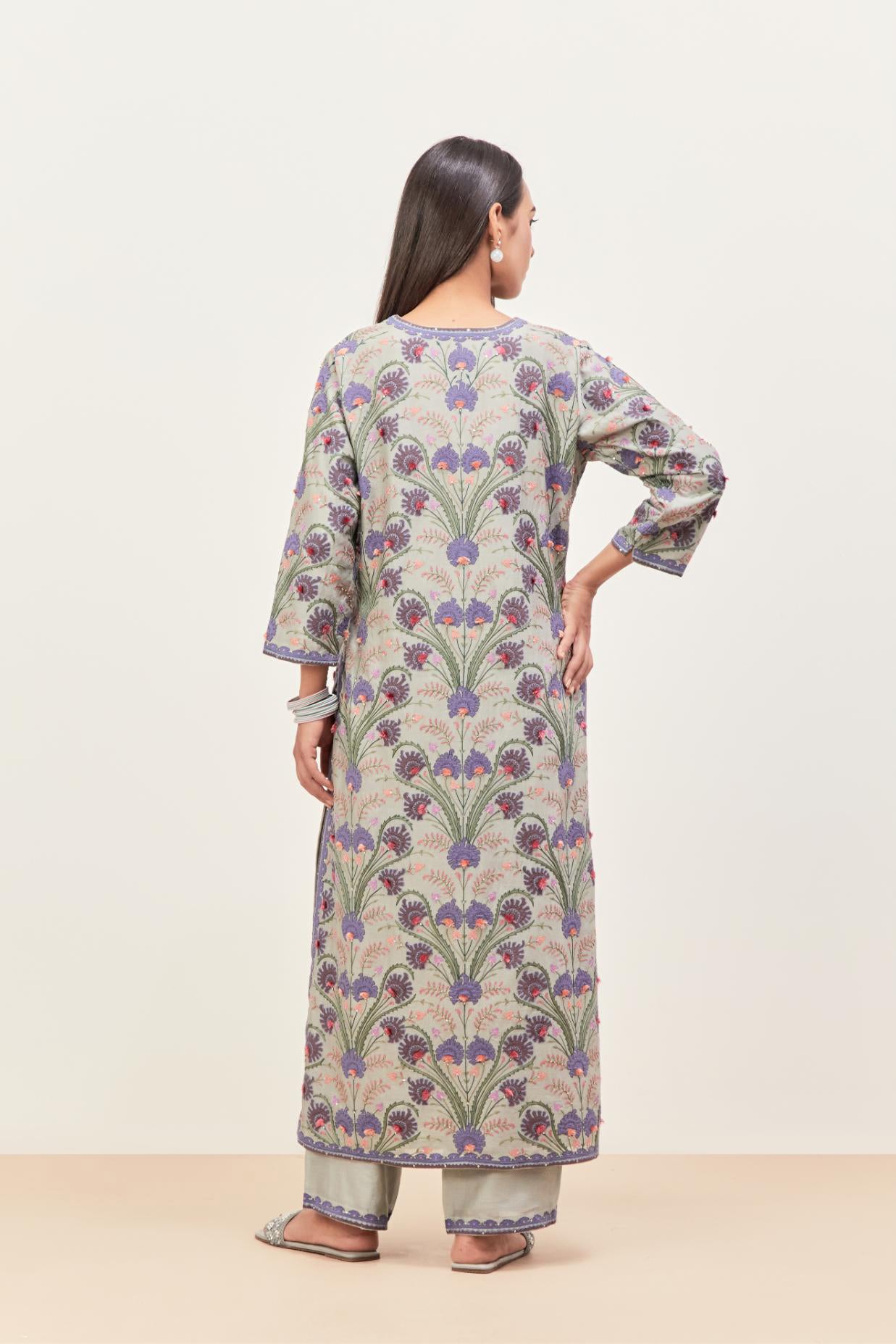 Bluish Grey straight kurta set, fully embroidered with appliqué flowers, multi-colored aari threadwork and silk tassels.