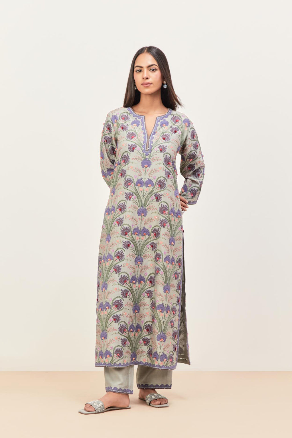 Bluish Grey straight kurta set, fully embroidered with appliqué flowers, multi-colored aari threadwork and silk tassels.