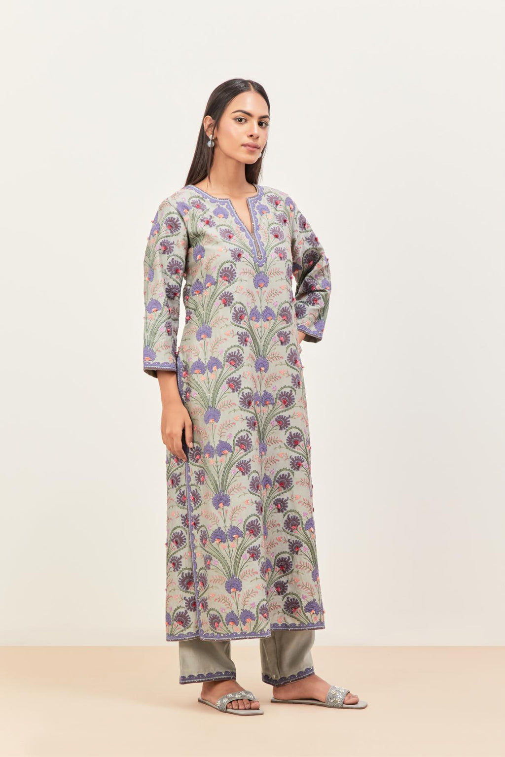 Bluish Grey straight kurta set, fully embroidered with appliqué flowers, multi-colored aari threadwork and silk tassels.