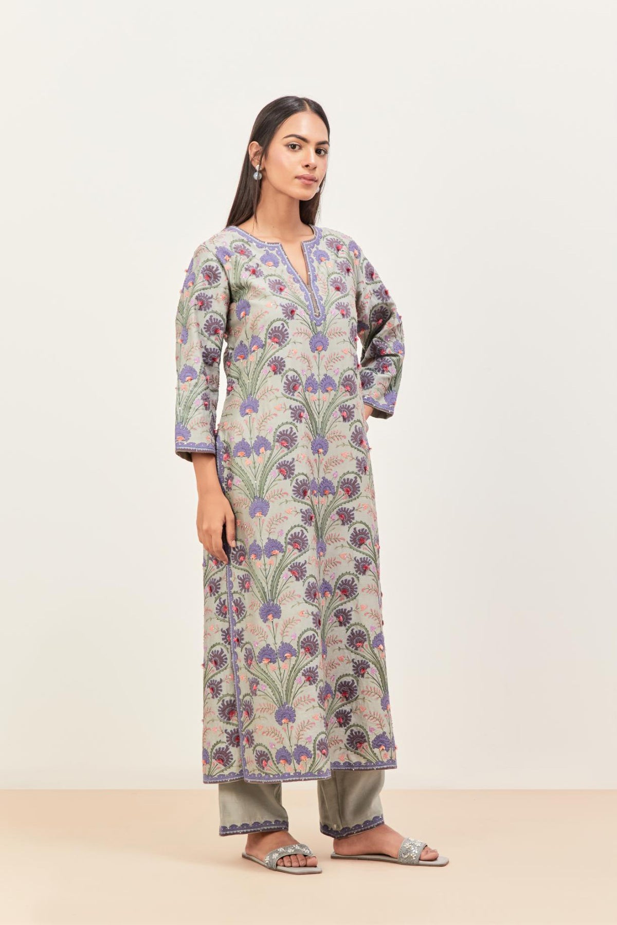 Bluish Grey straight kurta set, fully embroidered with appliqué flowers, multi-colored aari threadwork and silk tassels.
