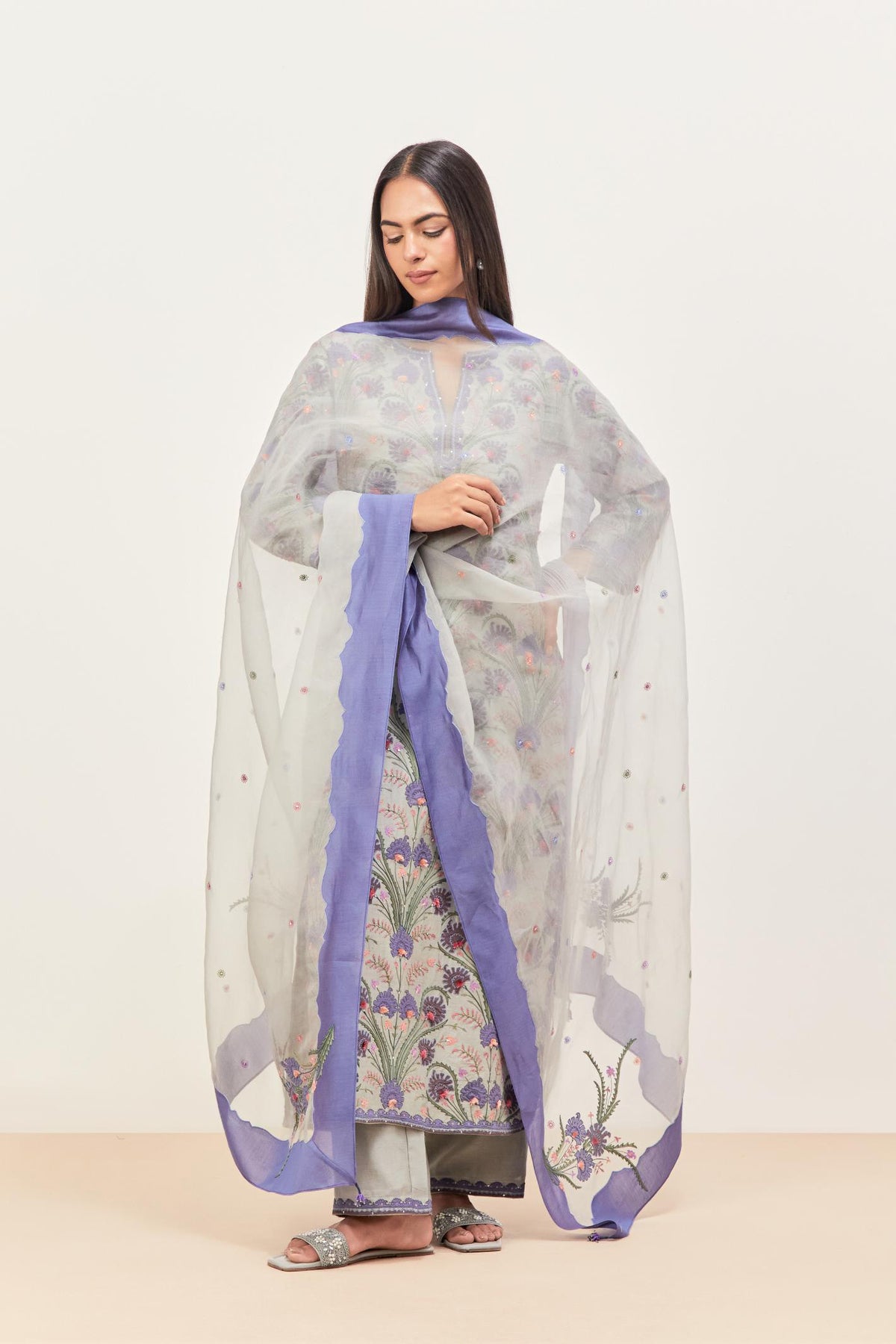Bluish grey & blue silk organza narrow dupatta, highlighted with all-over delicate thread flower and applique floral boota at all four corners.
