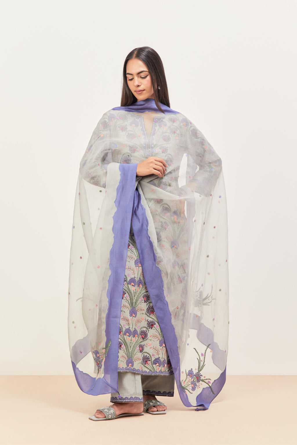 Bluish grey & blue silk organza narrow dupatta, highlighted with all-over delicate thread flower and applique floral boota at all four corners.