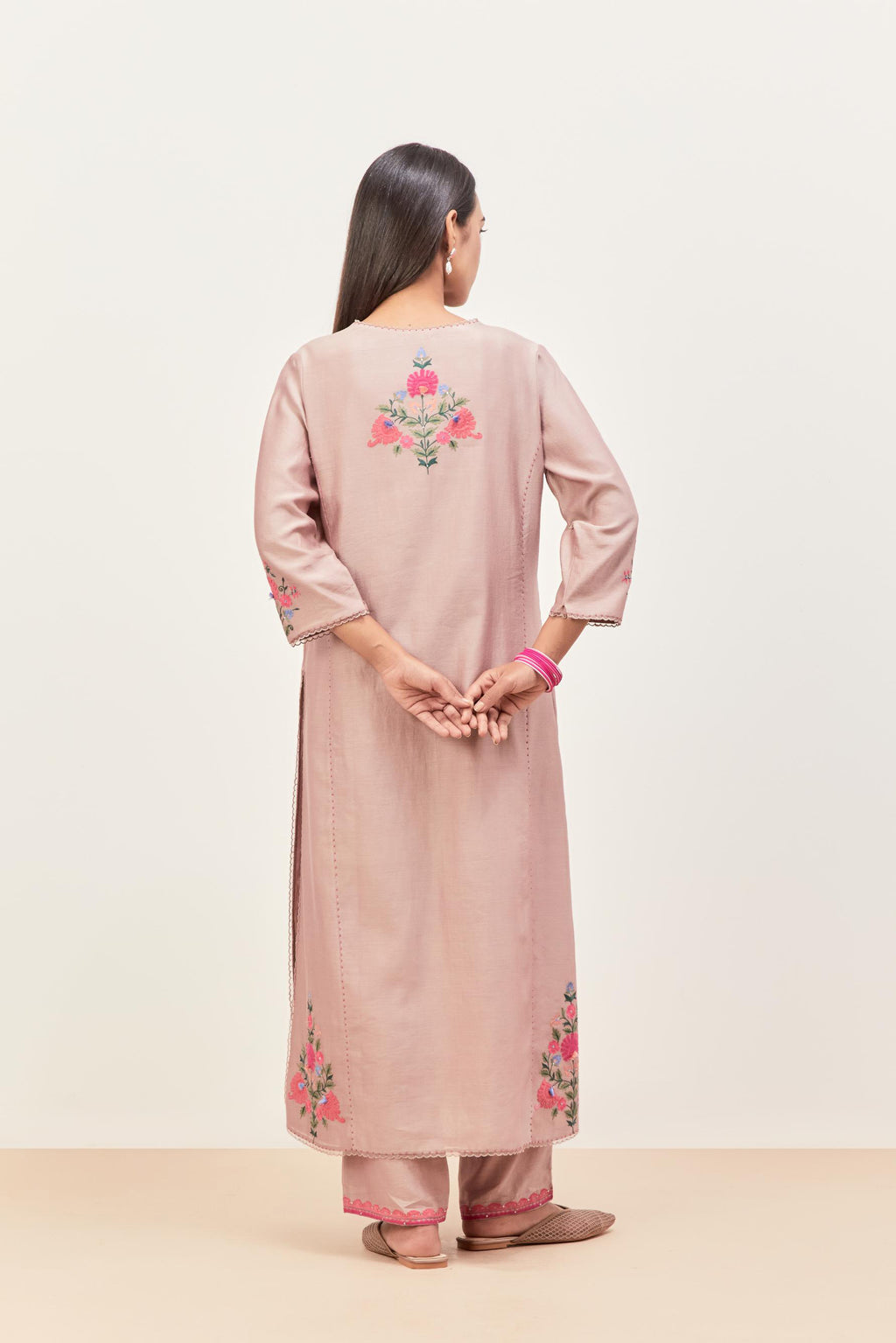 Lilac silk chanderi kurta set with pin tucks in the front & back and floral applique boota at sides, highlighted with aari threadwork & sequins.