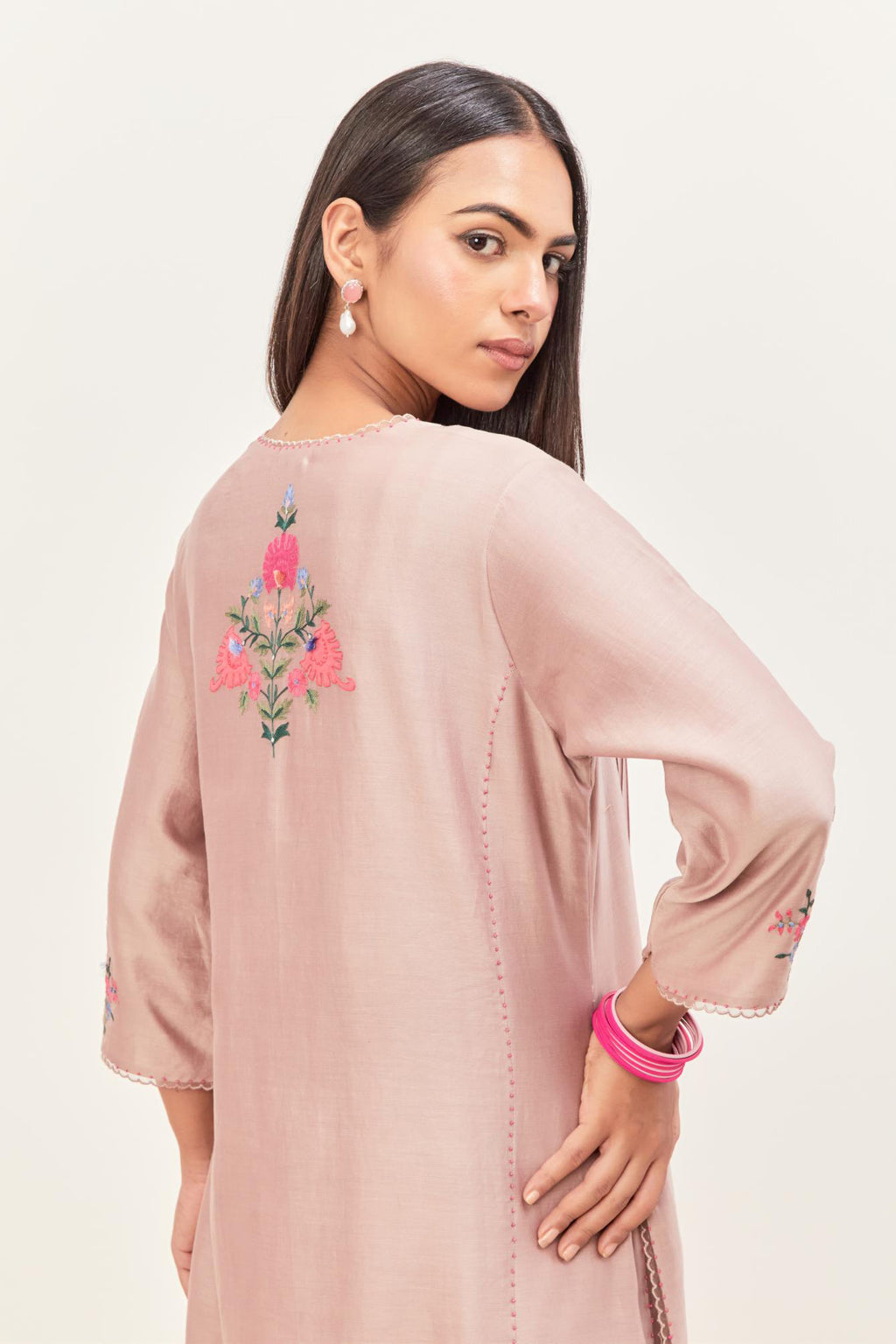 Lilac silk chanderi kurta set with pin tucks in the front & back and floral applique boota at sides, highlighted with aari threadwork & sequins.