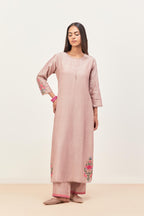 Lilac silk chanderi kurta set with pin tucks in the front & back and floral applique boota at sides, highlighted with aari threadwork & sequins.