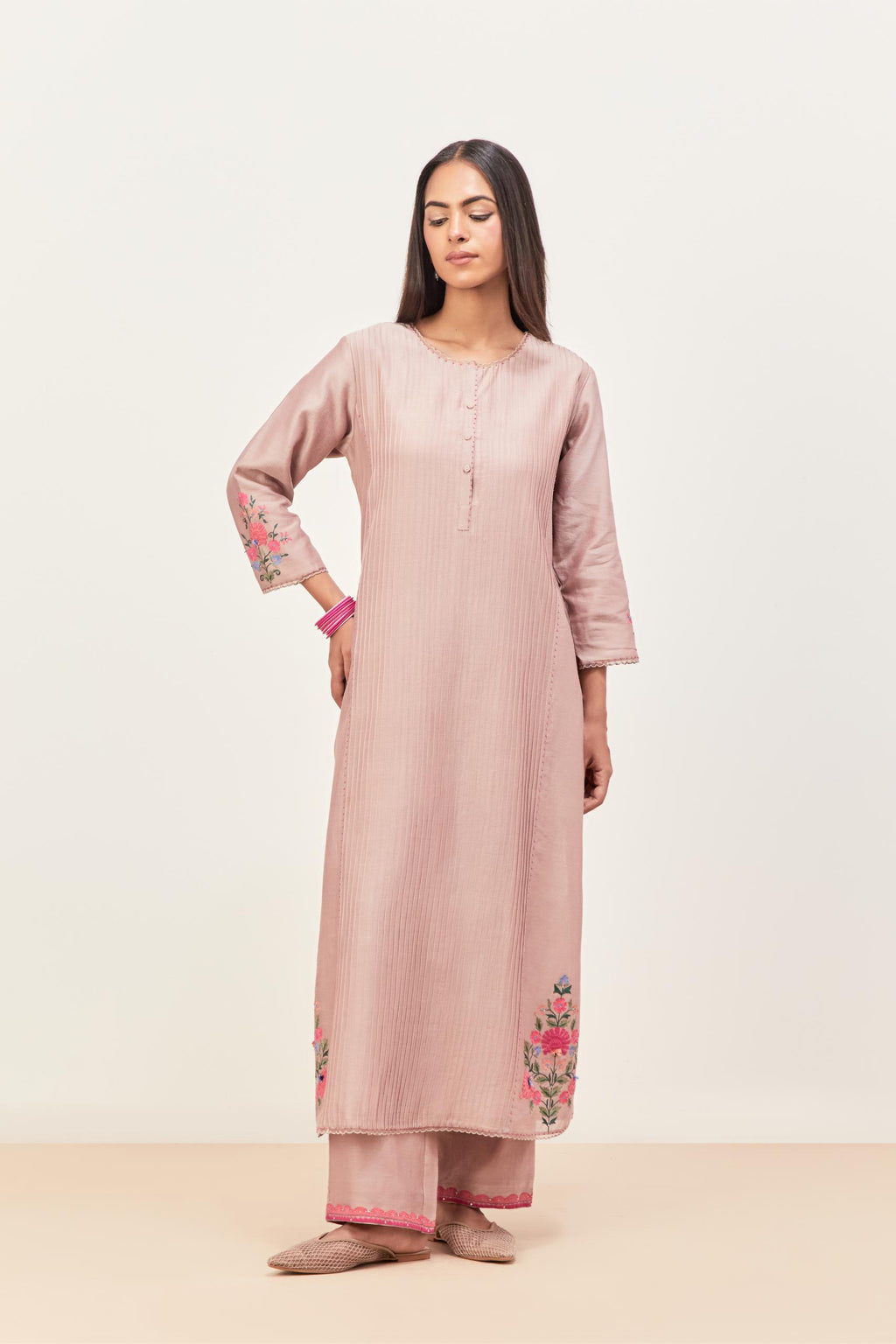 Lilac silk chanderi kurta set with pin tucks in the front & back and floral applique boota at sides, highlighted with aari threadwork & sequins.
