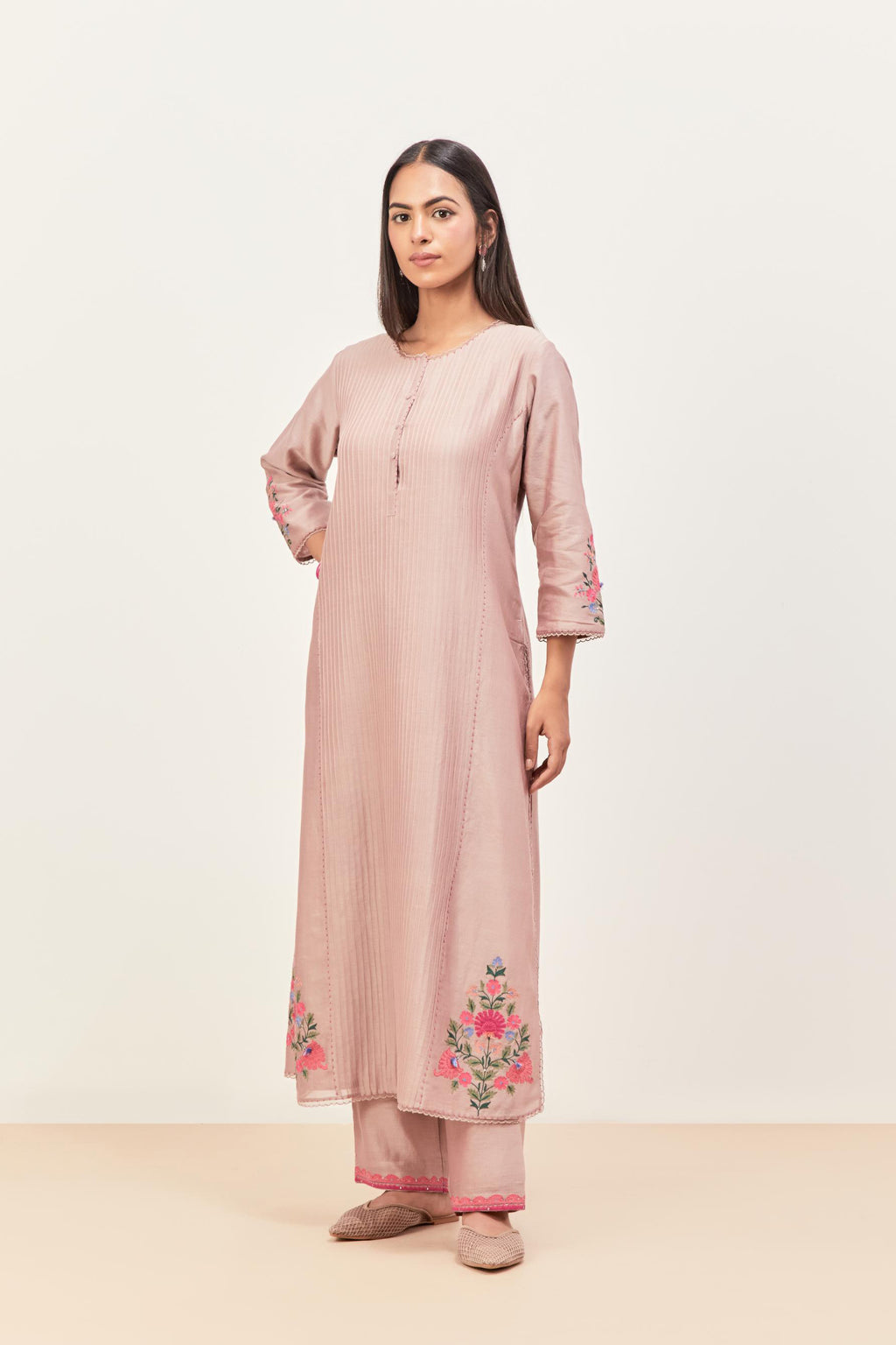 Lilac silk chanderi kurta set with pin tucks in the front & back and floral applique boota at sides, highlighted with aari threadwork & sequins.