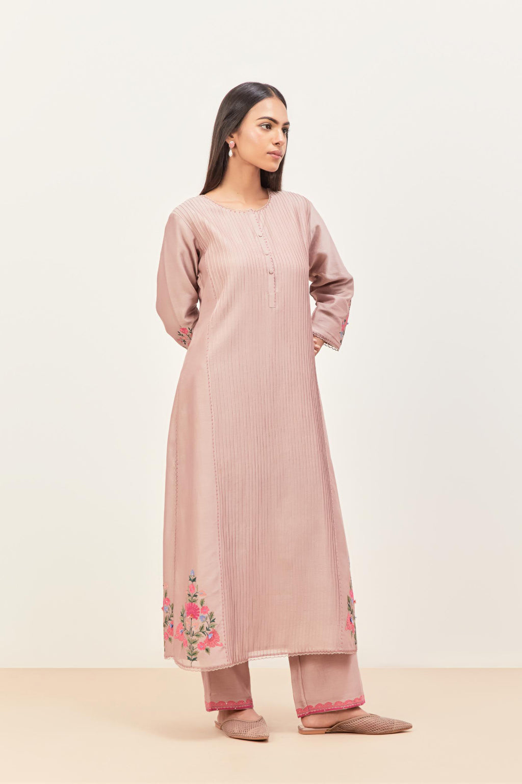 Lilac silk chanderi kurta set with pin tucks in the front & back and floral applique boota at sides, highlighted with aari threadwork & sequins.