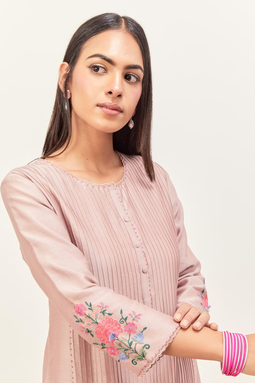 Lilac silk chanderi kurta set with pin tucks in the front & back and floral applique boota at sides, highlighted with aari threadwork & sequins.
