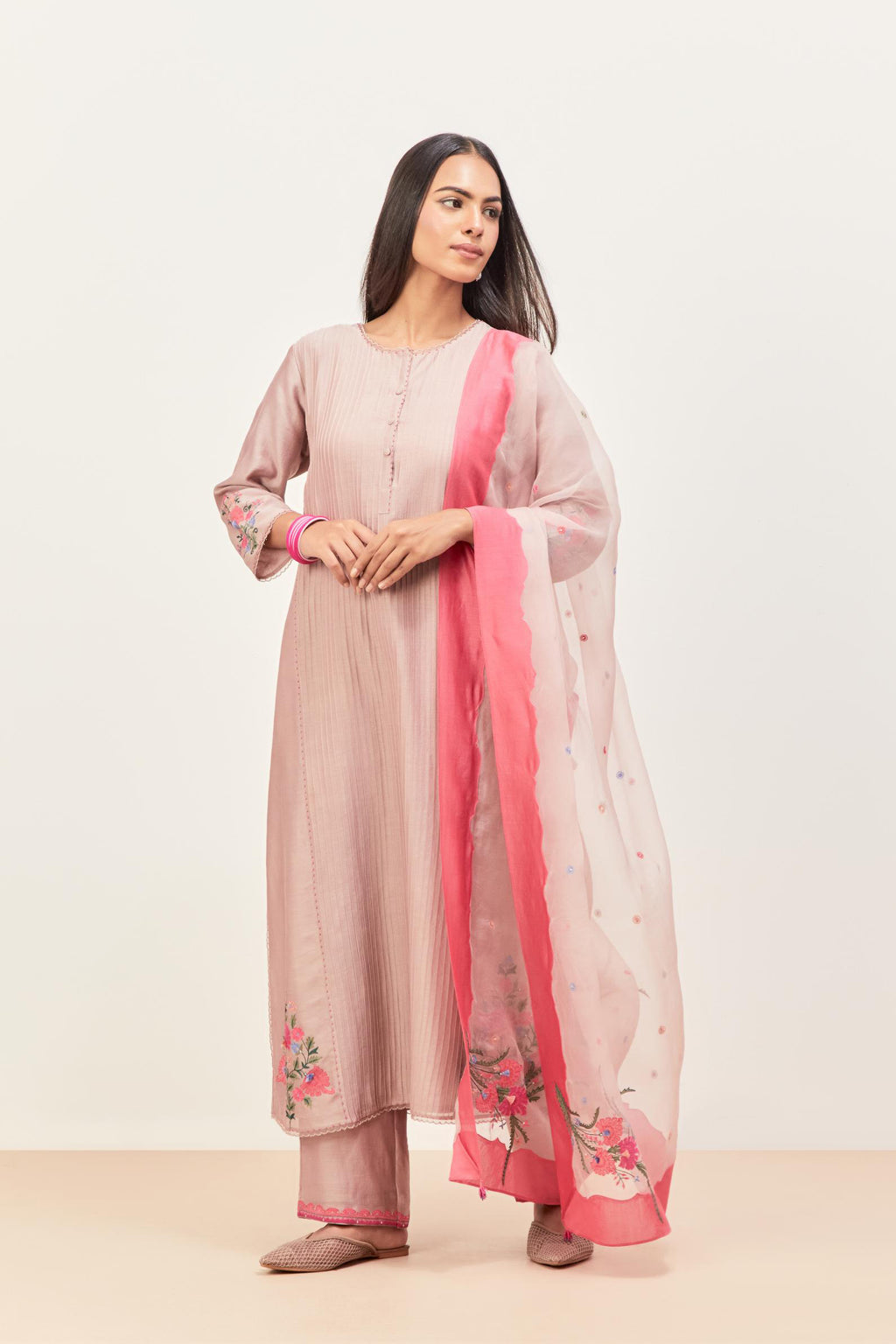 Lilac silk chanderi kurta set with pin tucks in the front & back and floral applique boota at sides, highlighted with aari threadwork & sequins.