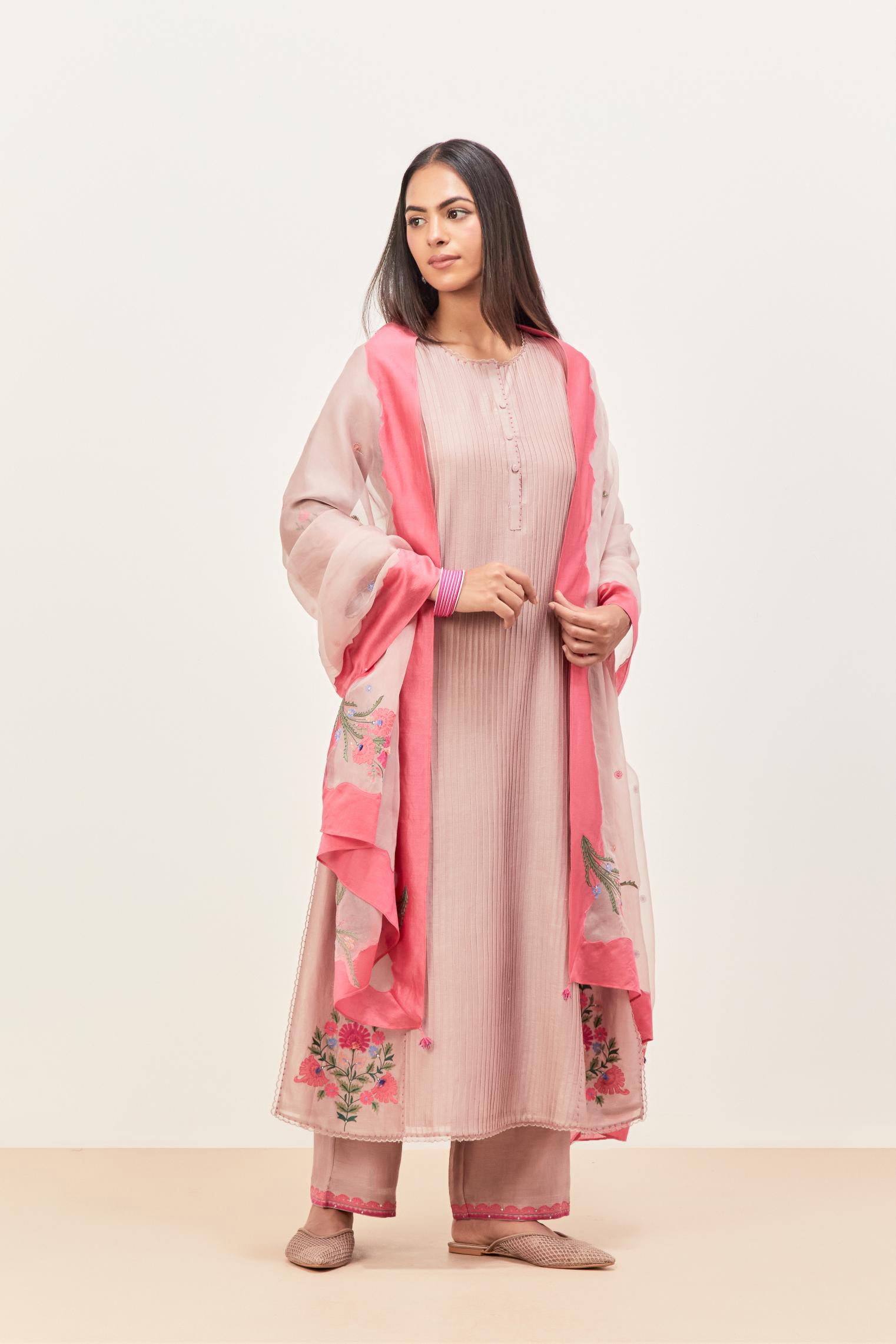 Lilac silk chanderi kurta set with pin tucks in the front & back and floral applique boota at sides, highlighted with aari threadwork & sequins.
