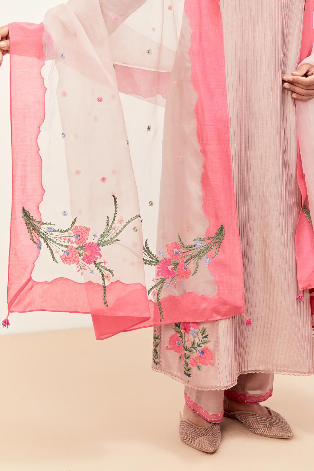 Lilac silk chanderi kurta set with pin tucks in the front & back and floral applique boota at sides, highlighted with aari threadwork & sequins.