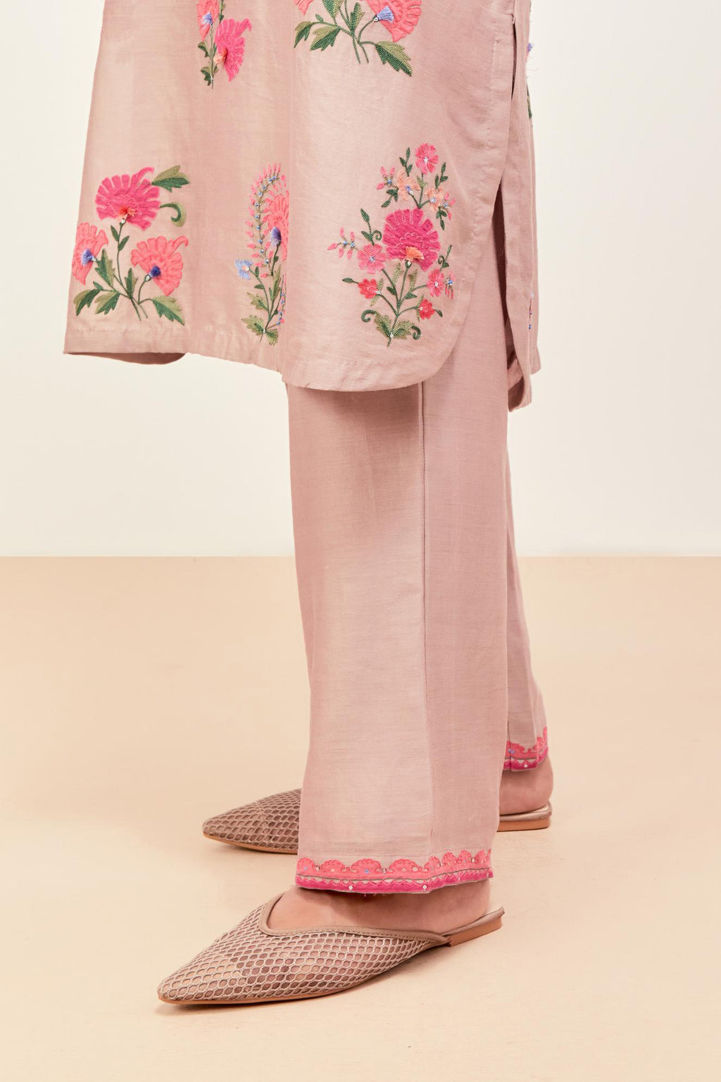 Lilac silk chanderi straight short easy fit kurta set with all-over assorted flower applique, highlighted with aari threadwork & sequins.
