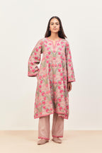 Lilac short A-line silk chanderi kurta set, fully embroidered with appliqué flowers, highlighted with aari thread work and silk tassels.