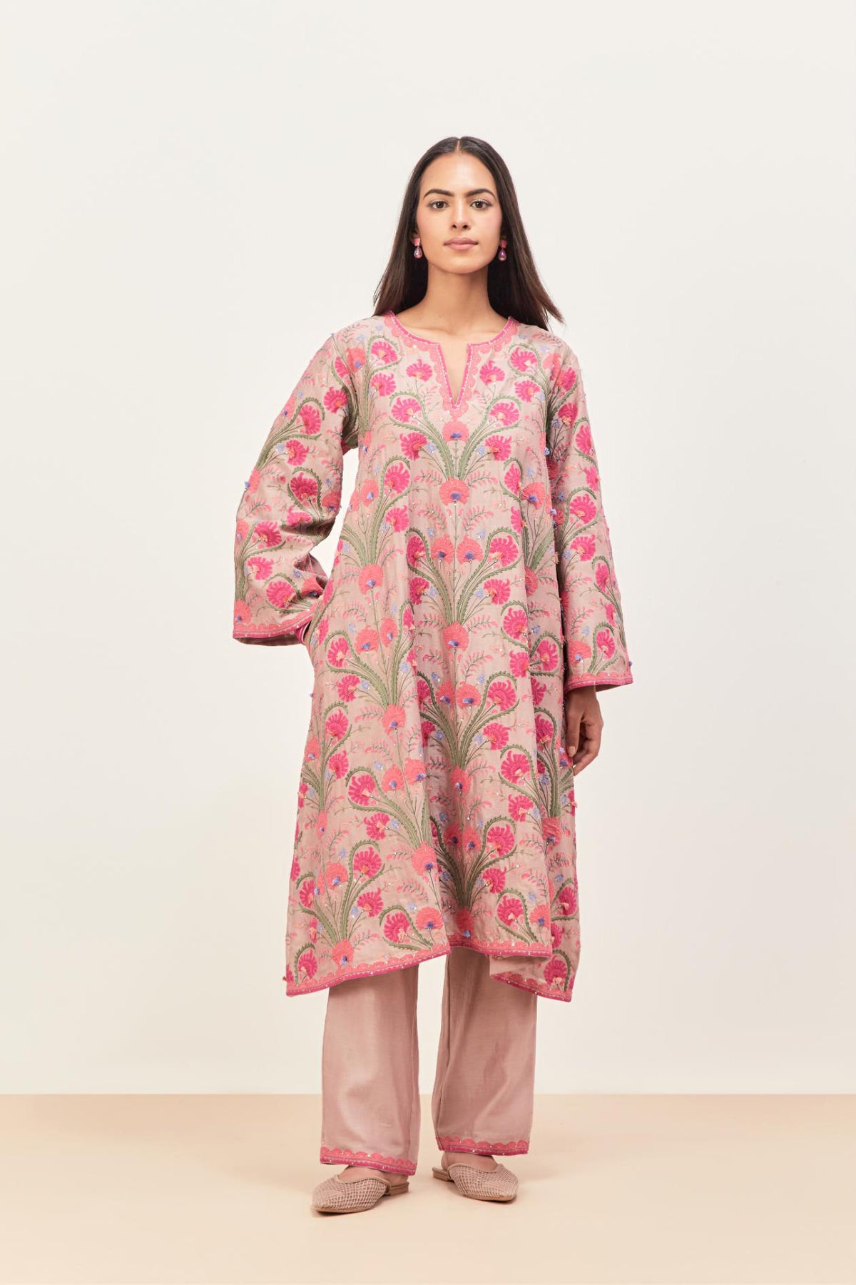 Lilac short A-line silk chanderi kurta set, fully embroidered with appliqué flowers, highlighted with aari thread work and silk tassels.