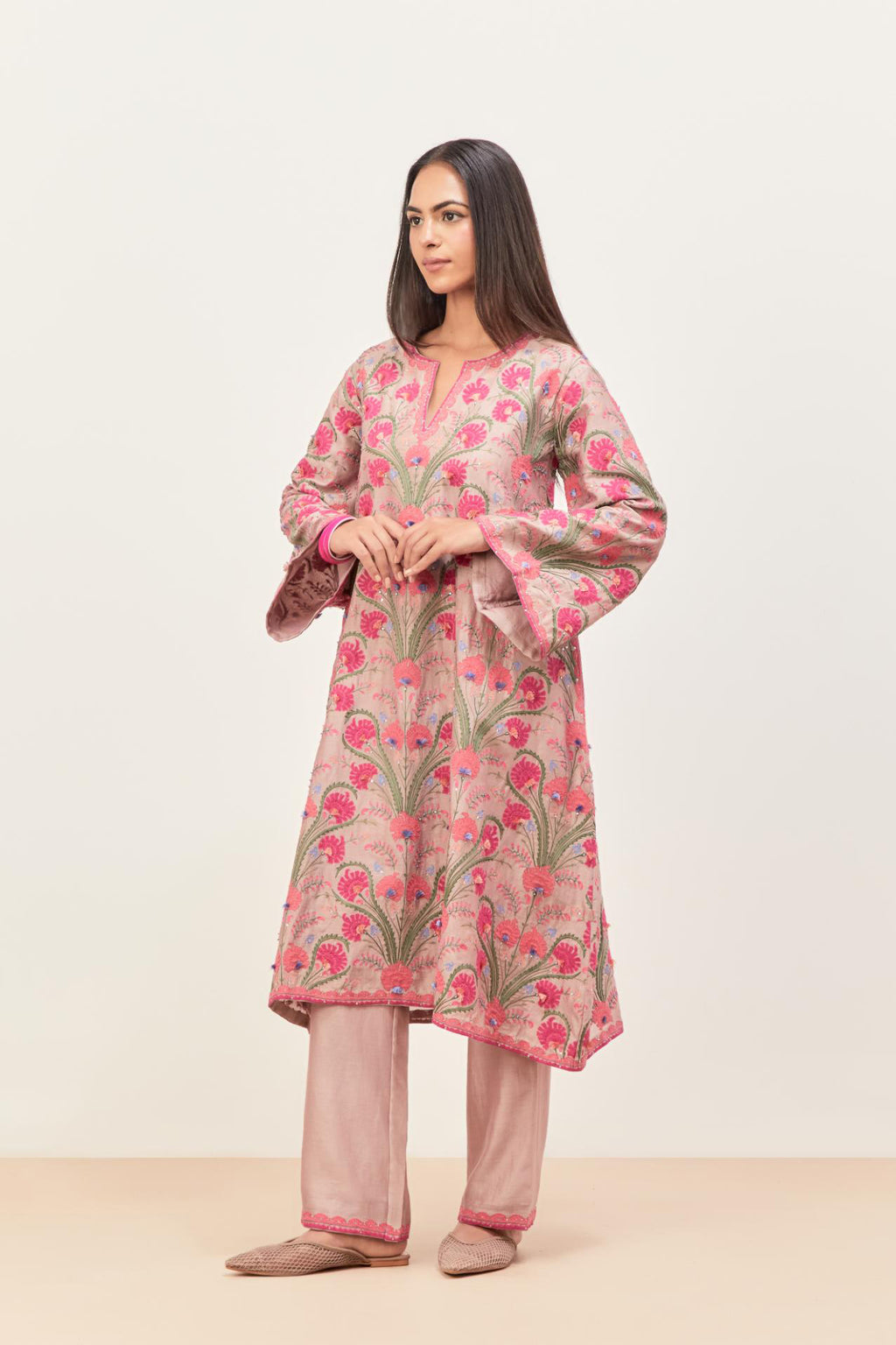Lilac short A-line silk chanderi kurta set, fully embroidered with appliqué flowers, highlighted with aari thread work and silk tassels.