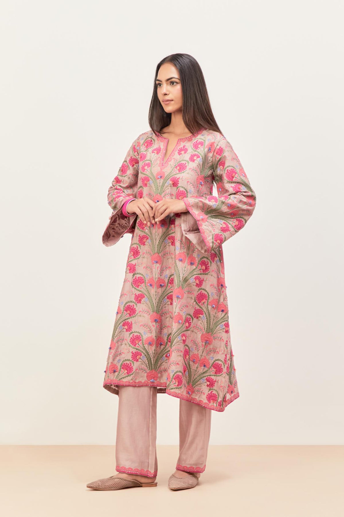 Lilac short A-line silk chanderi kurta set, fully embroidered with appliqué flowers, highlighted with aari thread work and silk tassels.